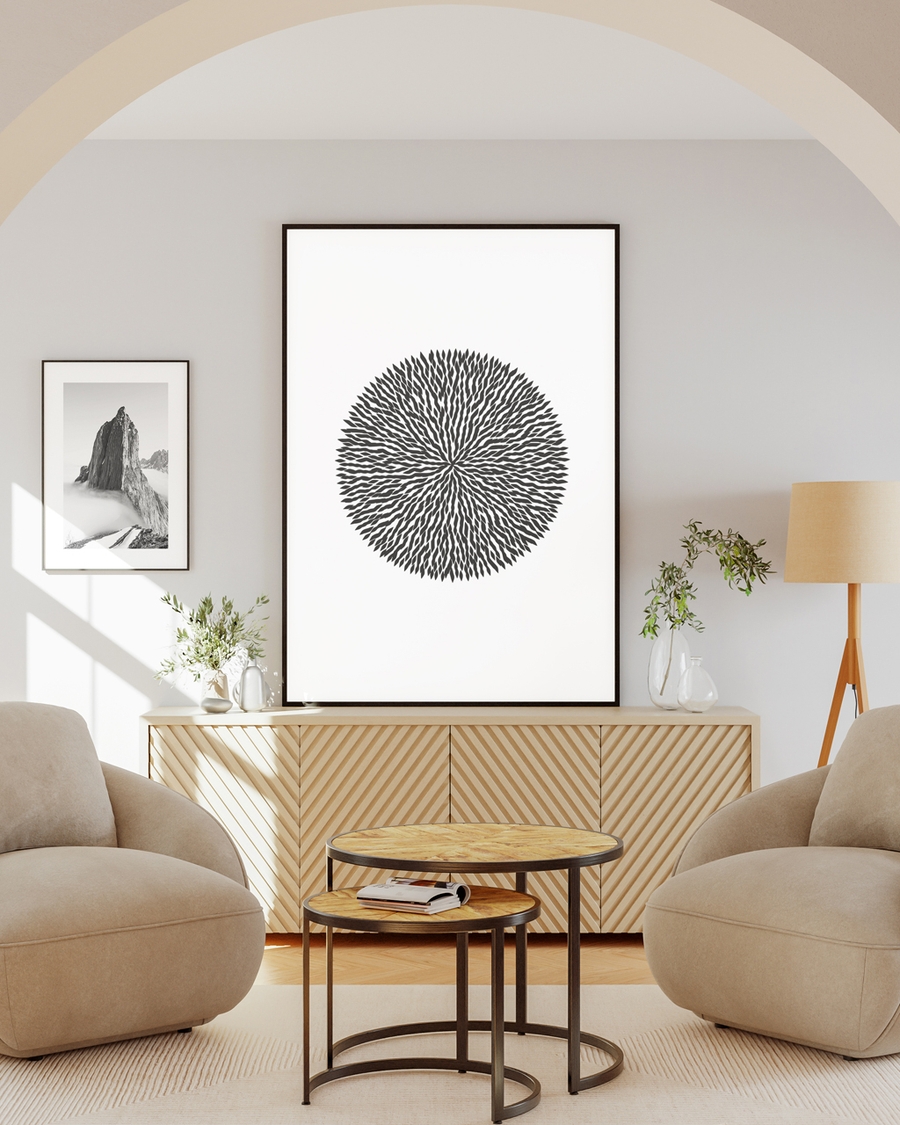 Poster of a dandelion-like lines on a off-white wall on a brown table