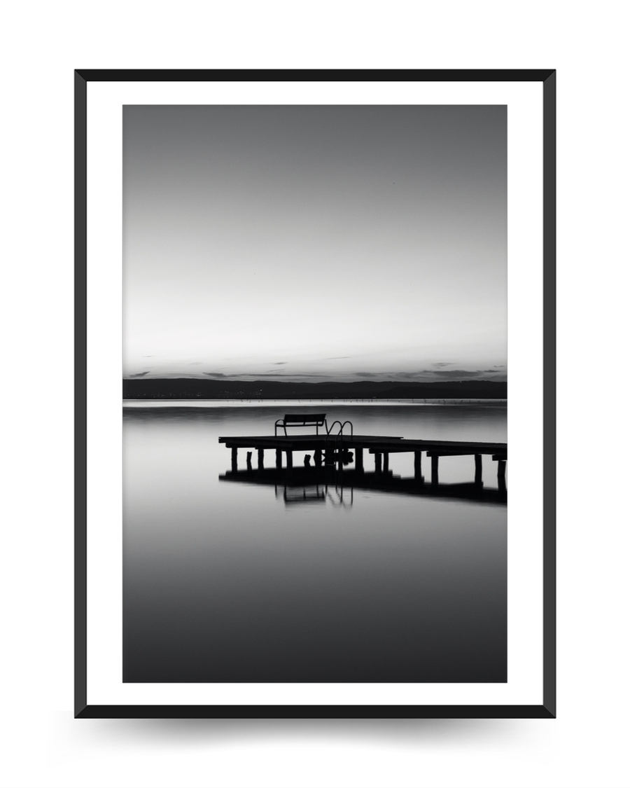 A poster of a Pier reflected in calm water at dusk