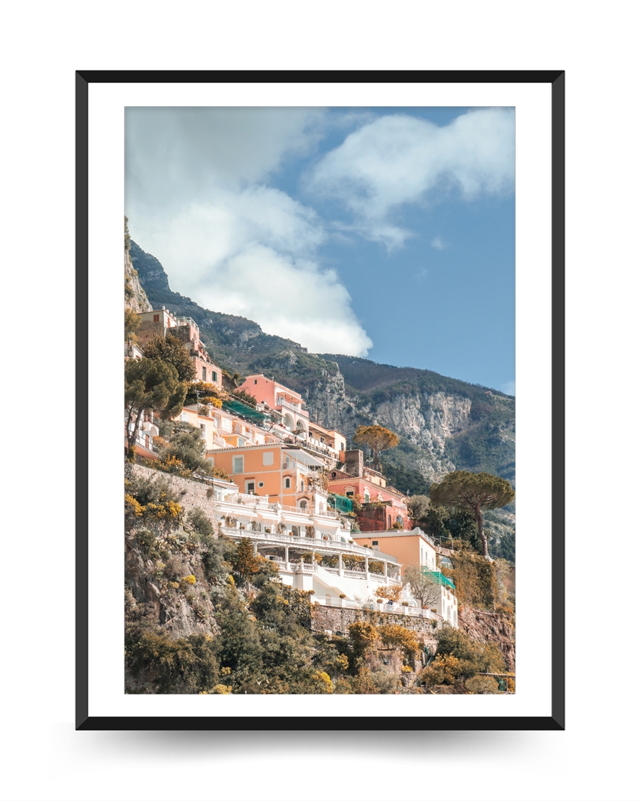 A poster of a Coastal houses on cliffs under clear sky