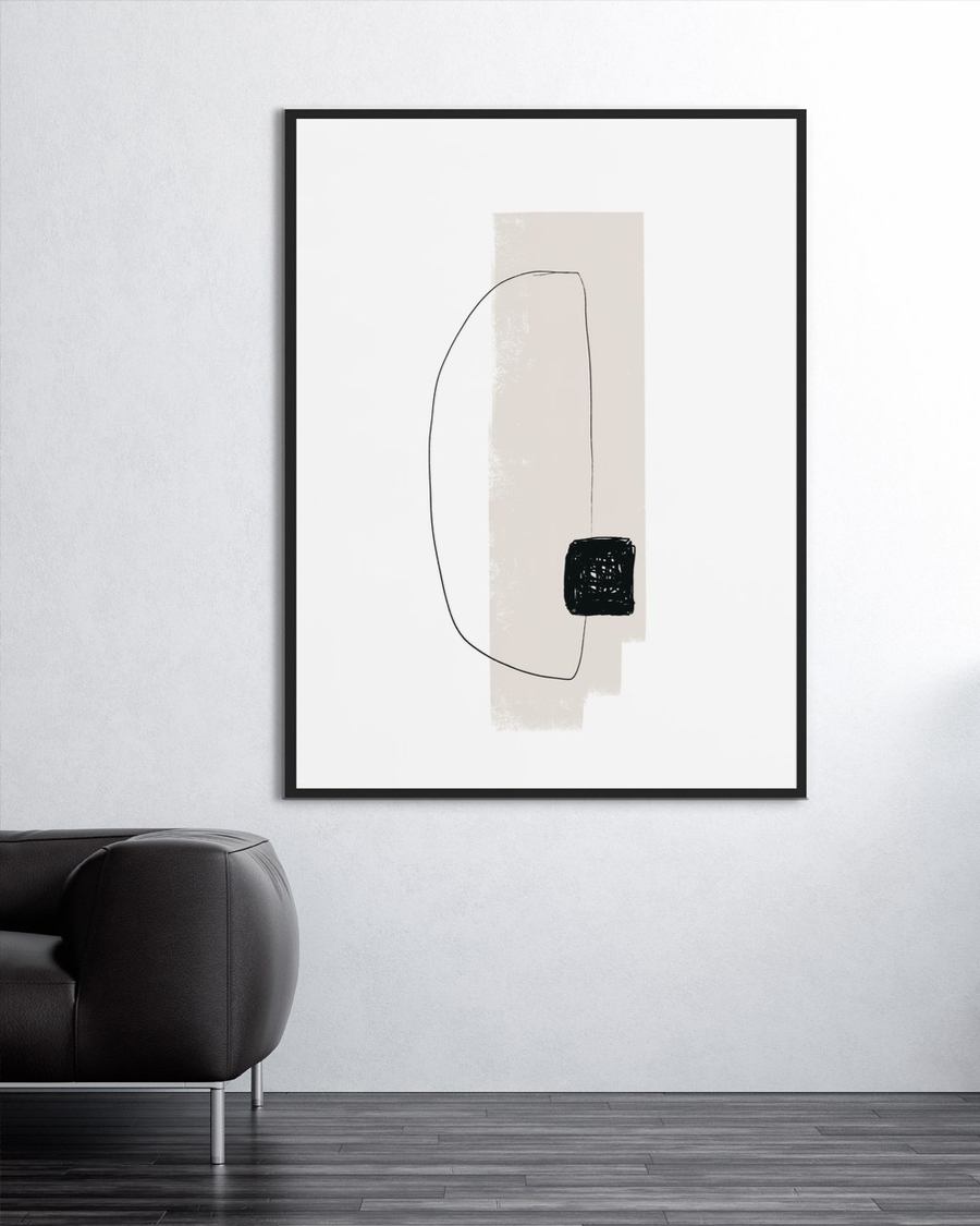 Scribbled Square poster in a slim black frame on a pale wall above a dark leather sofa