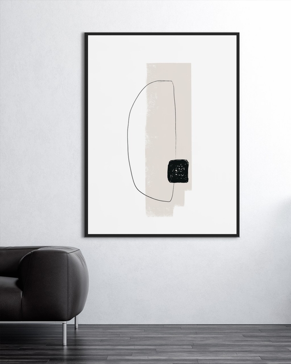 Scribbled Square poster in a slim black frame on a pale wall above a dark leather sofa