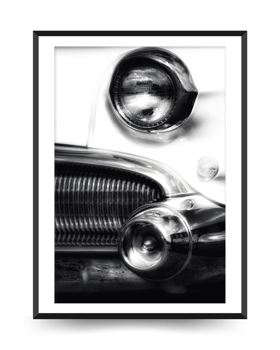 A poster of a Black and white close up of classic car front