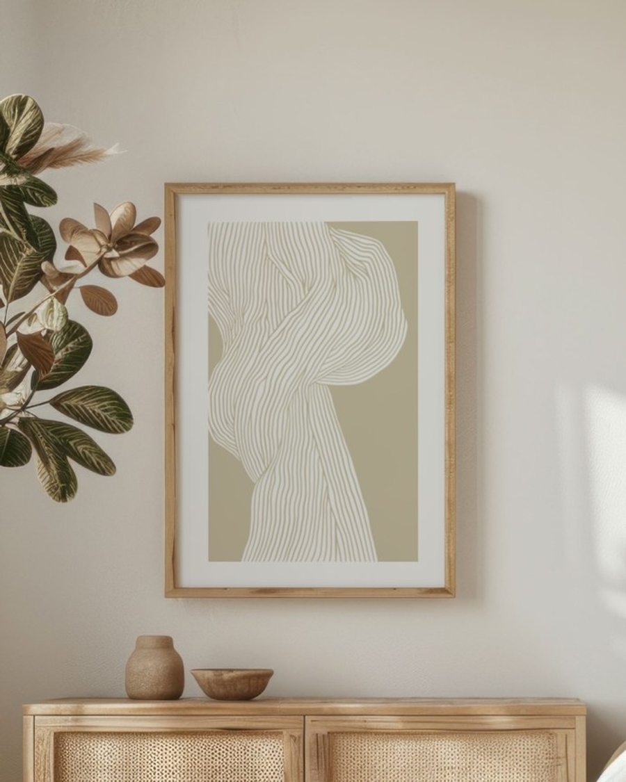 Woven Veil poster in a light oak frame above a rattan sideboard in a serene bedroom
