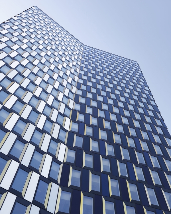 Tall modern building with geometric patterned windows