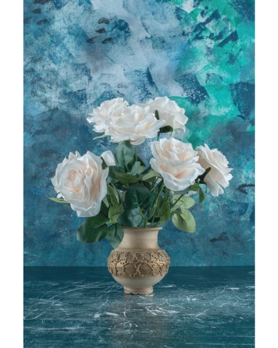 White roses in ceramic vase with teal background