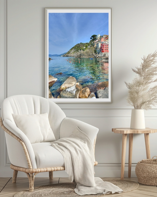 Colorful houses on rocky coast with clear water