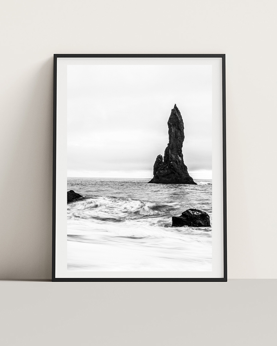 A poster of a tall sea stack in monochrome ocean view