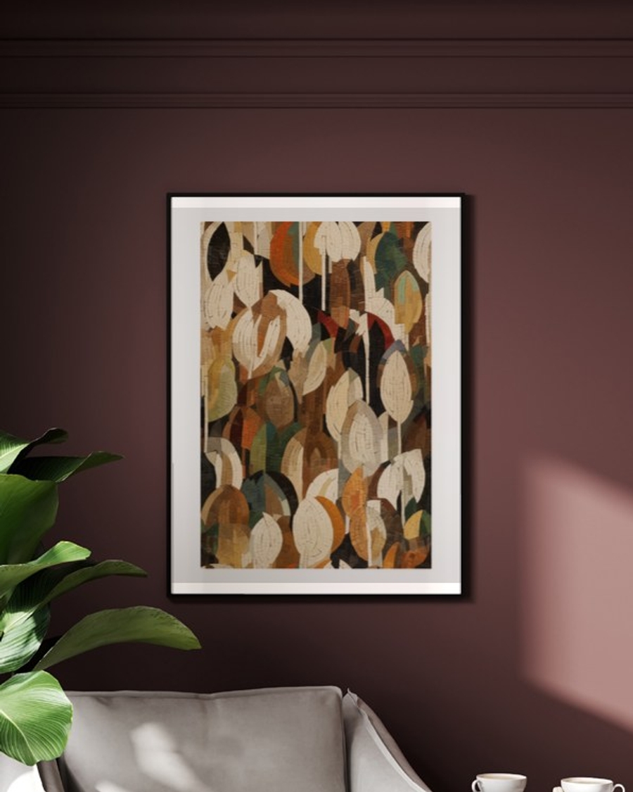 Mosaic Leaf Canopy poster in a slim black frame on a deep burgundy wall above a cream armchair