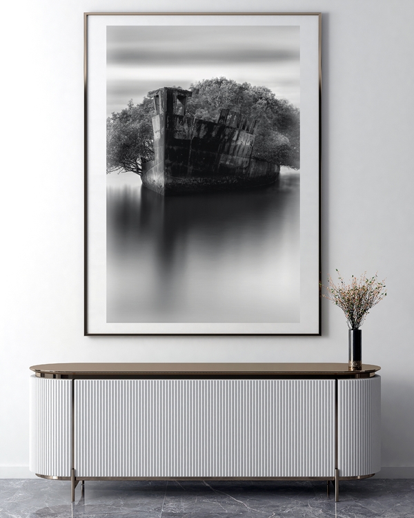 A poster of a Abandoned shipwreck reflected in calm monochrome water