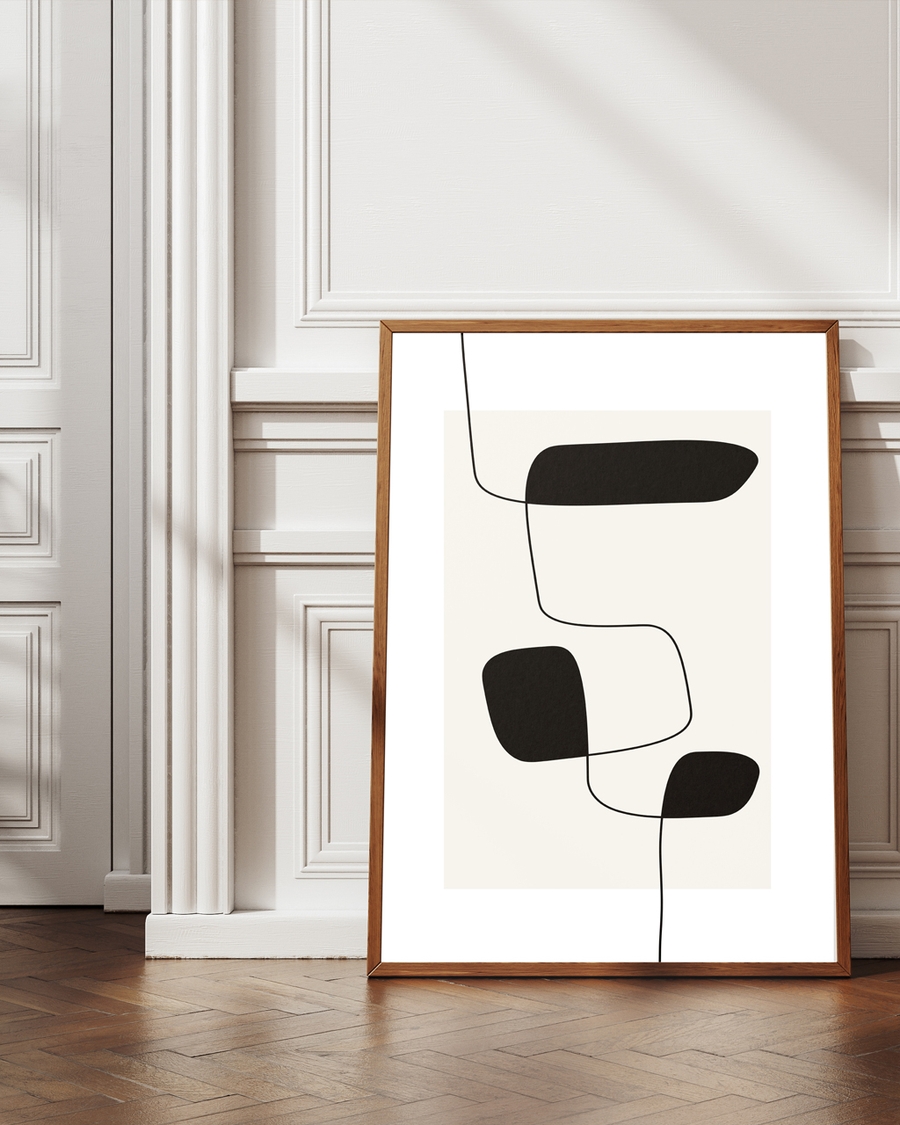 A poster of black random lines with abstract shapes laid on the ground