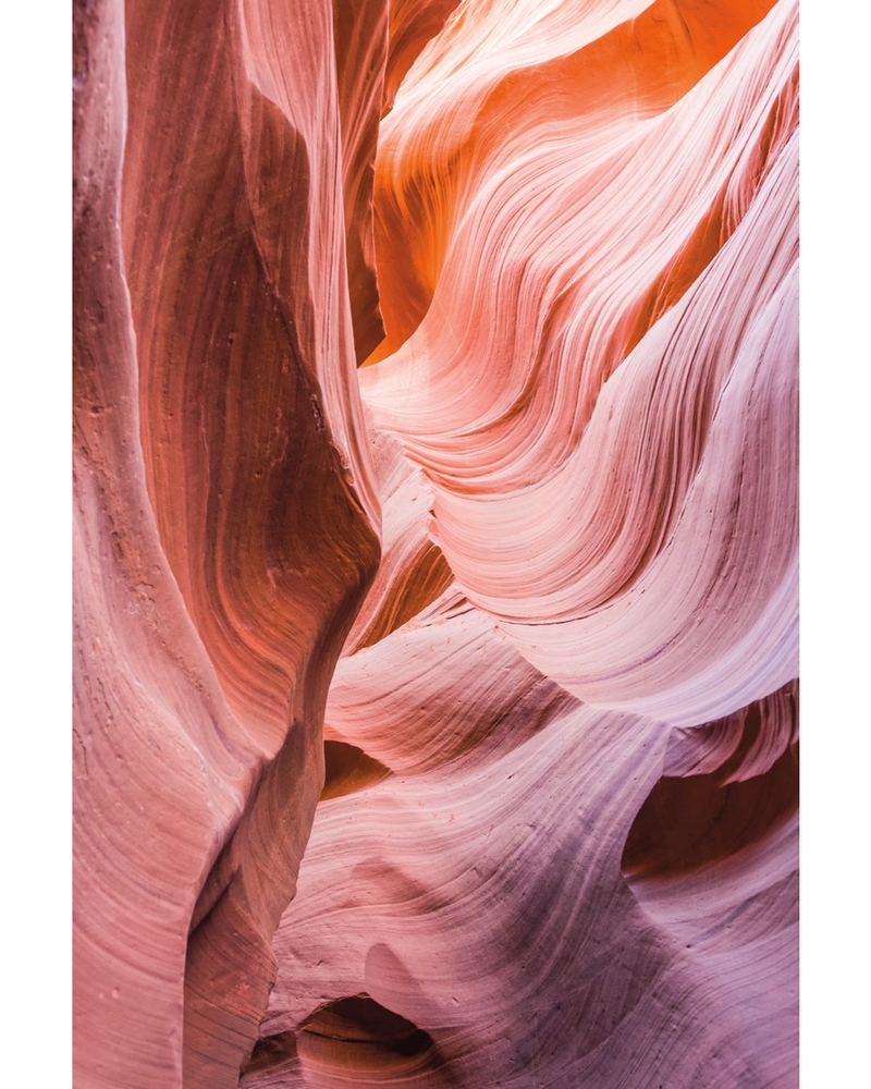 Flowing sandstone canyon formations in warm earth tones