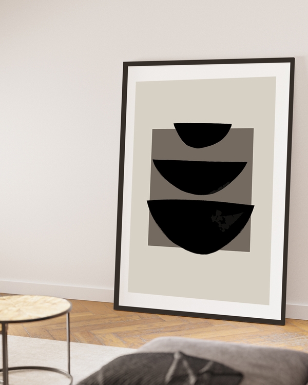 A poster of a three black semi-circles stacked on taupe background