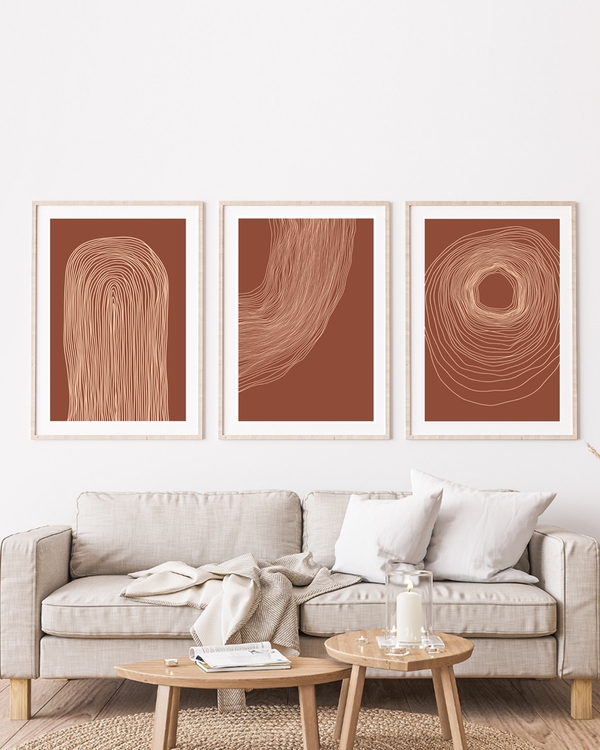 Three framed minimal posters of random lines hanged in the living room