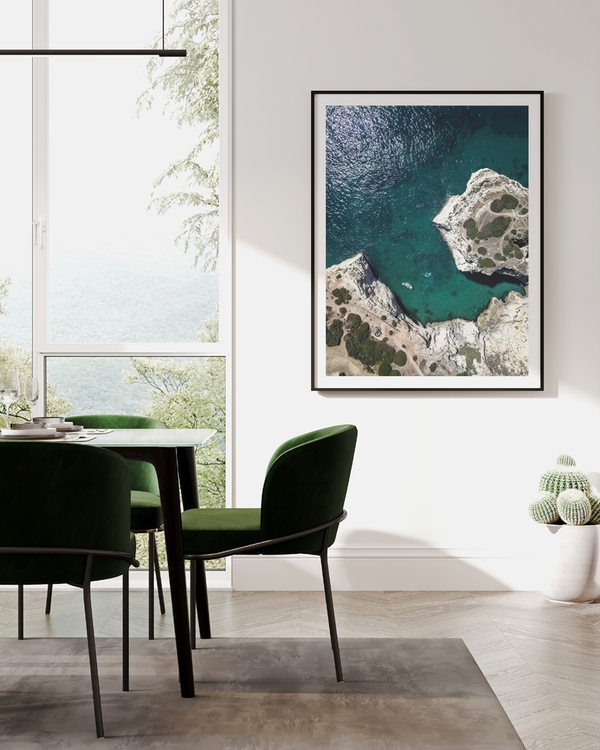 A poster of a Aerial view of turquoise sea and rocky cliffs