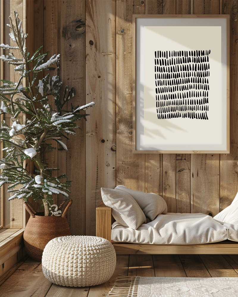 A framed abstract poster of small black dots hanged on a wall