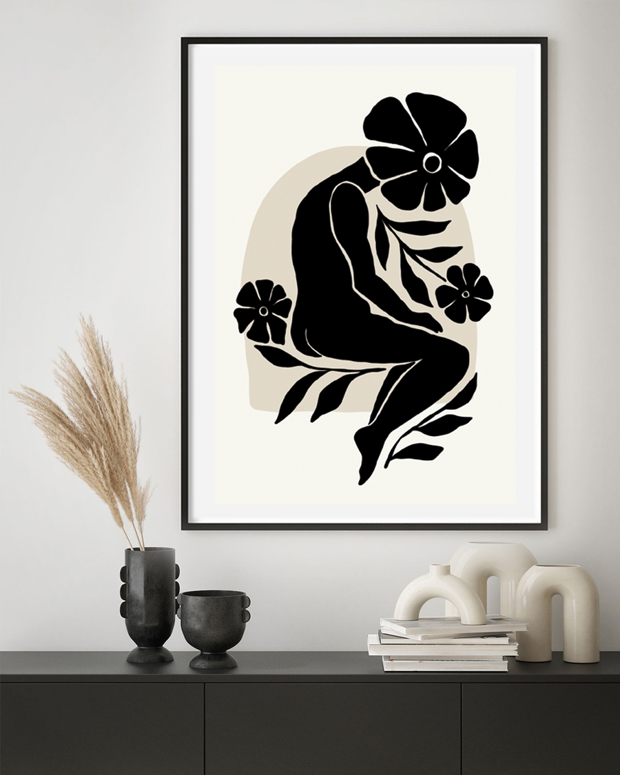 A poster of a black human silhouette with floral elements on beige
