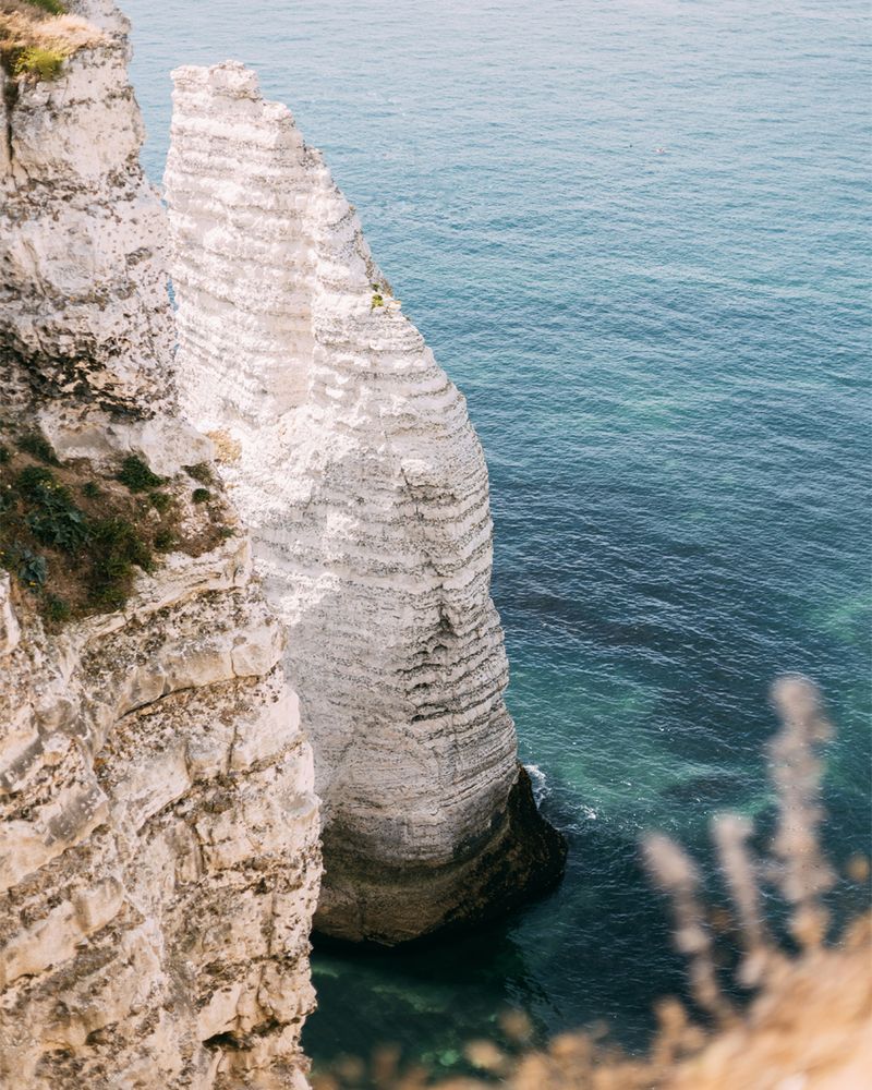 A coastal with white cliff and blue water