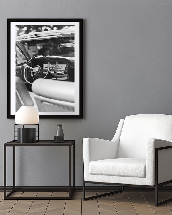 A poster of a Black and white vintage car interior from driver seat