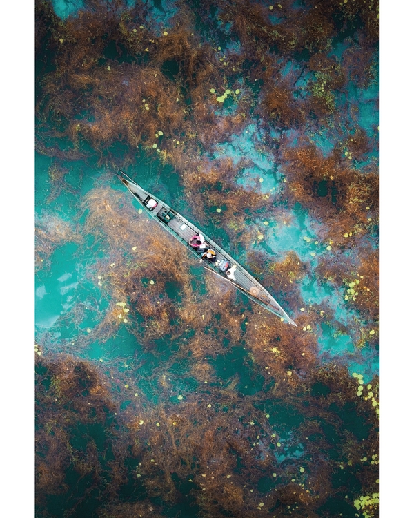 Boat seen from above on turquoise water