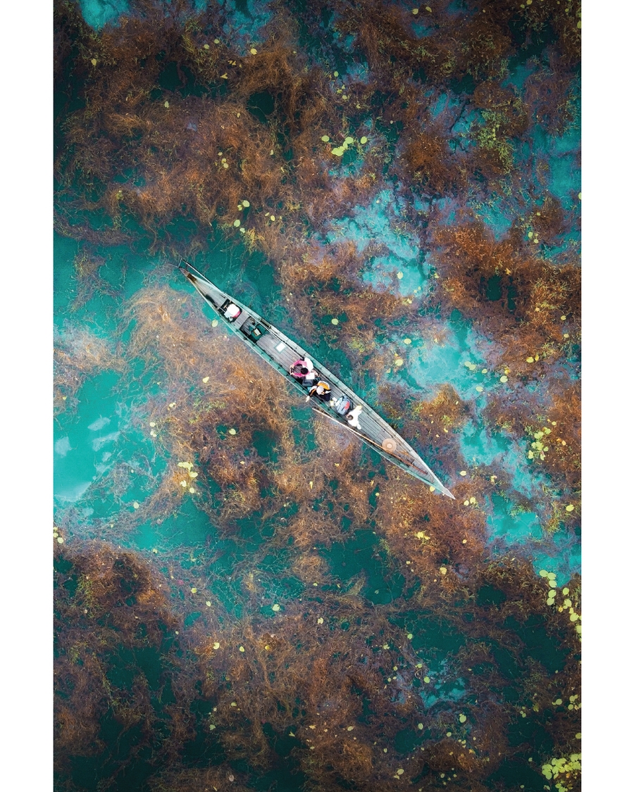 Boat seen from above on turquoise water