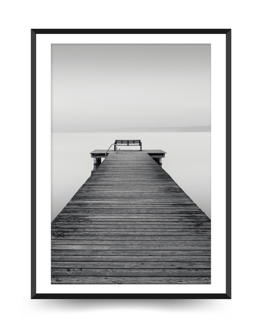 A poster of a Wooden pier leading into calm water and horizon