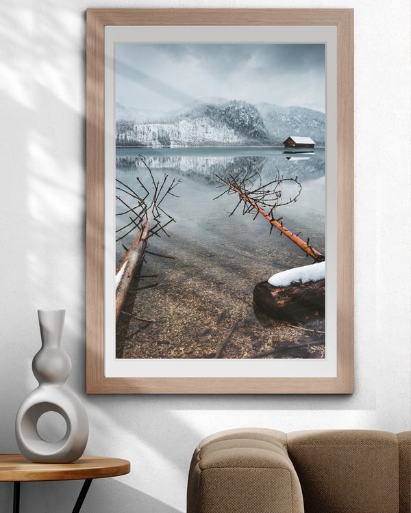 A poster of a Snowy mountains reflected in calm winter lake