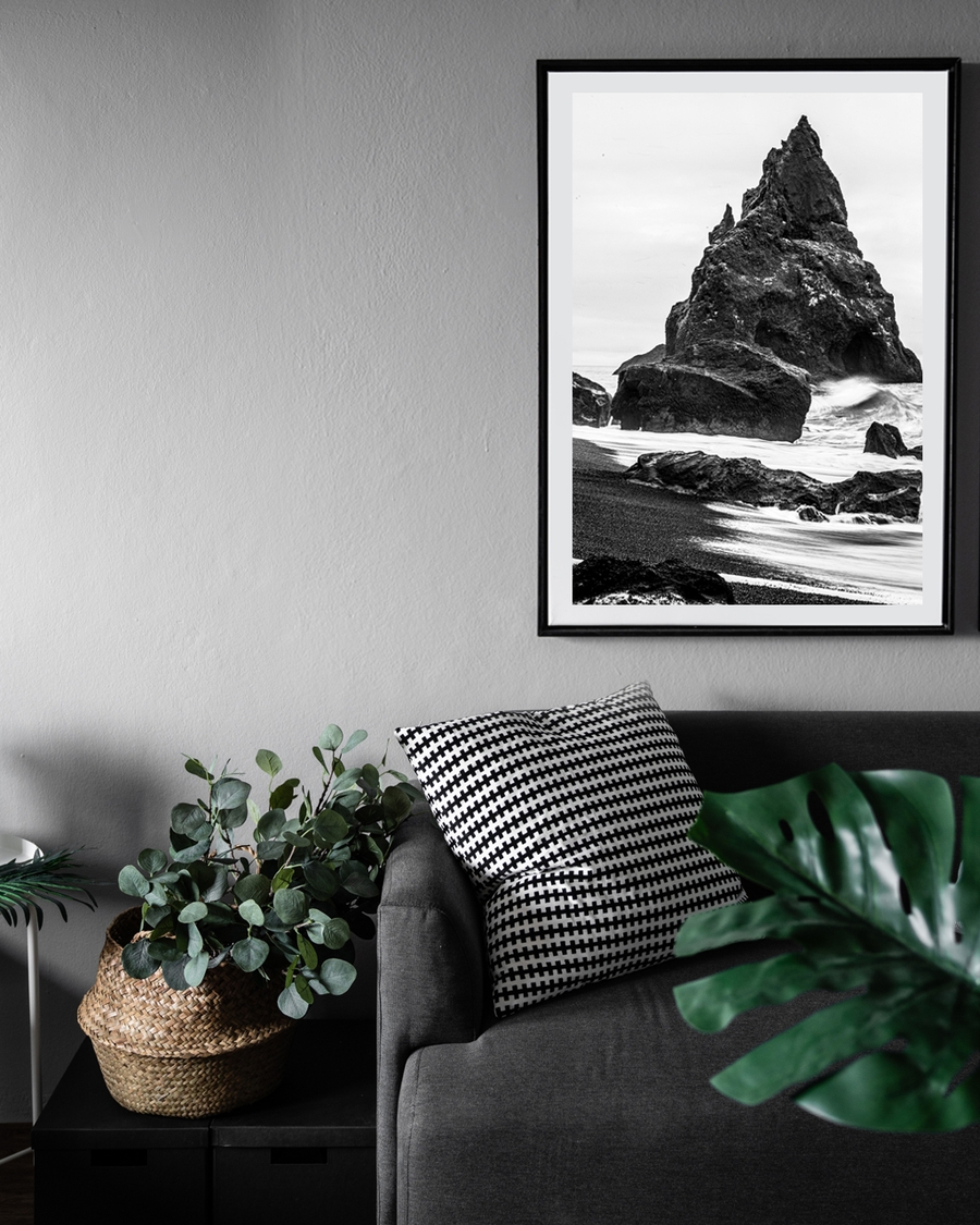 A poster of a Black and white photo of rugged sea rock