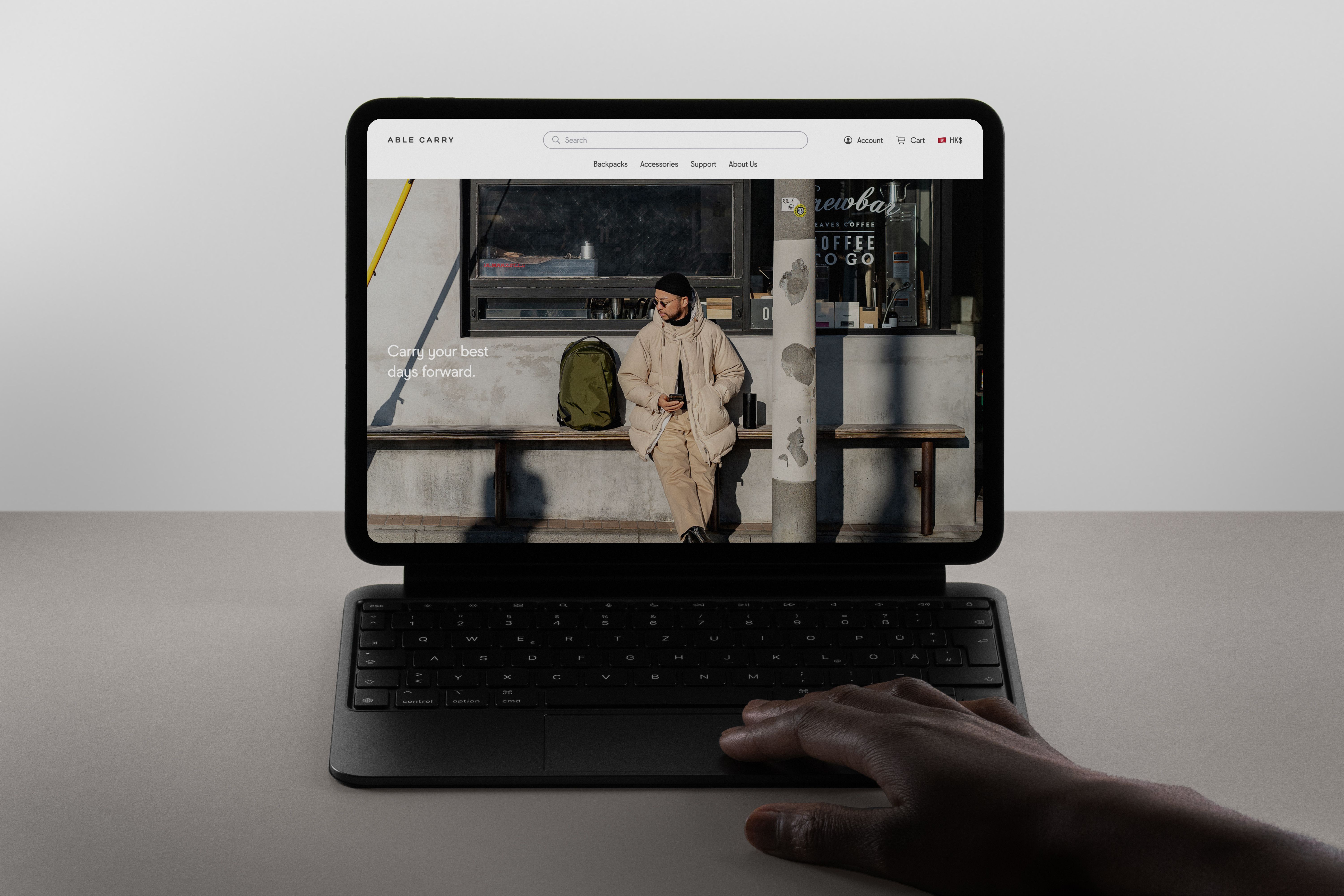 An iPad Pro displaying Able Carry's product page on its screen.