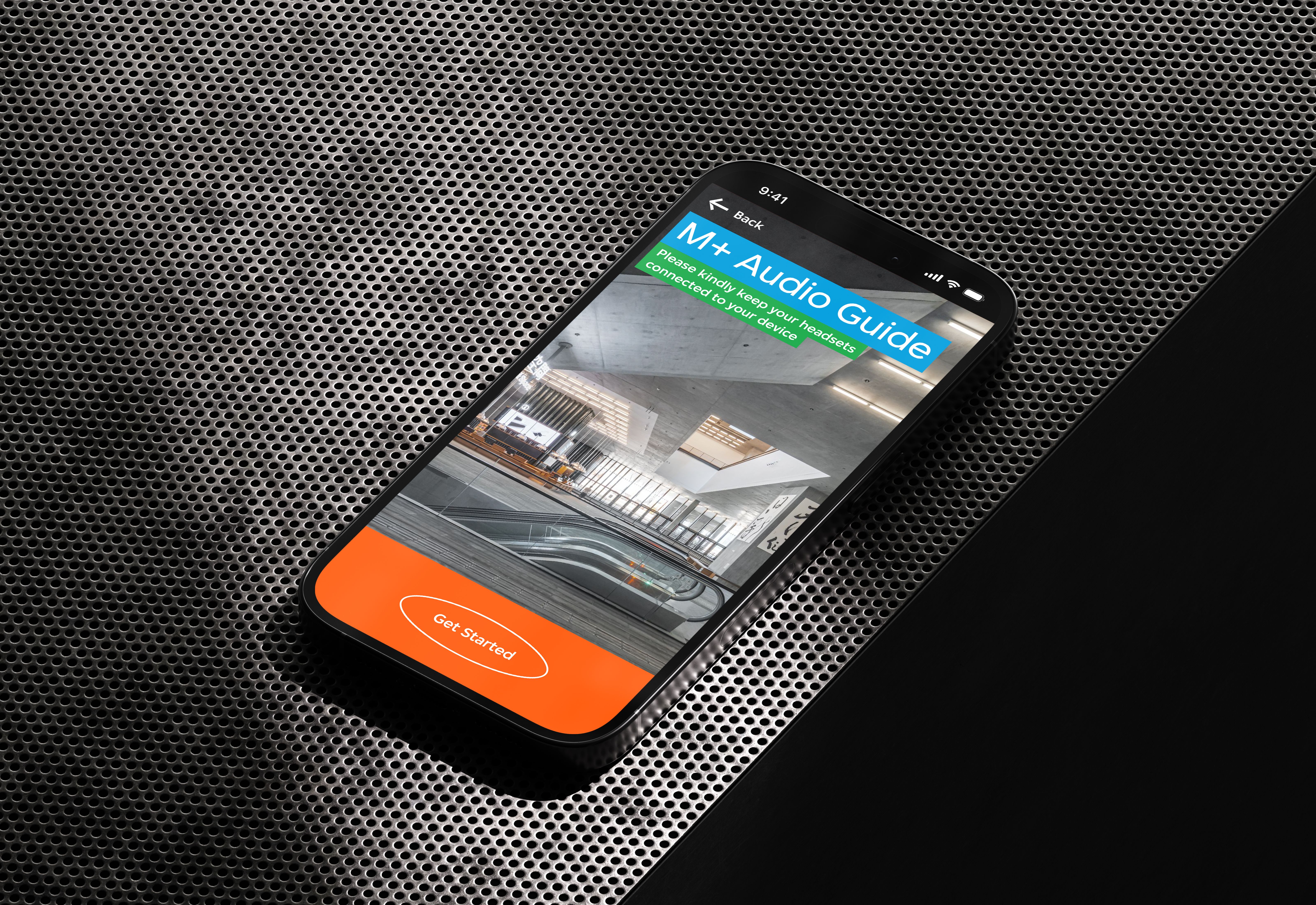 The M+ Audio Guide start up interface on an iPhone 14 Pro's display.