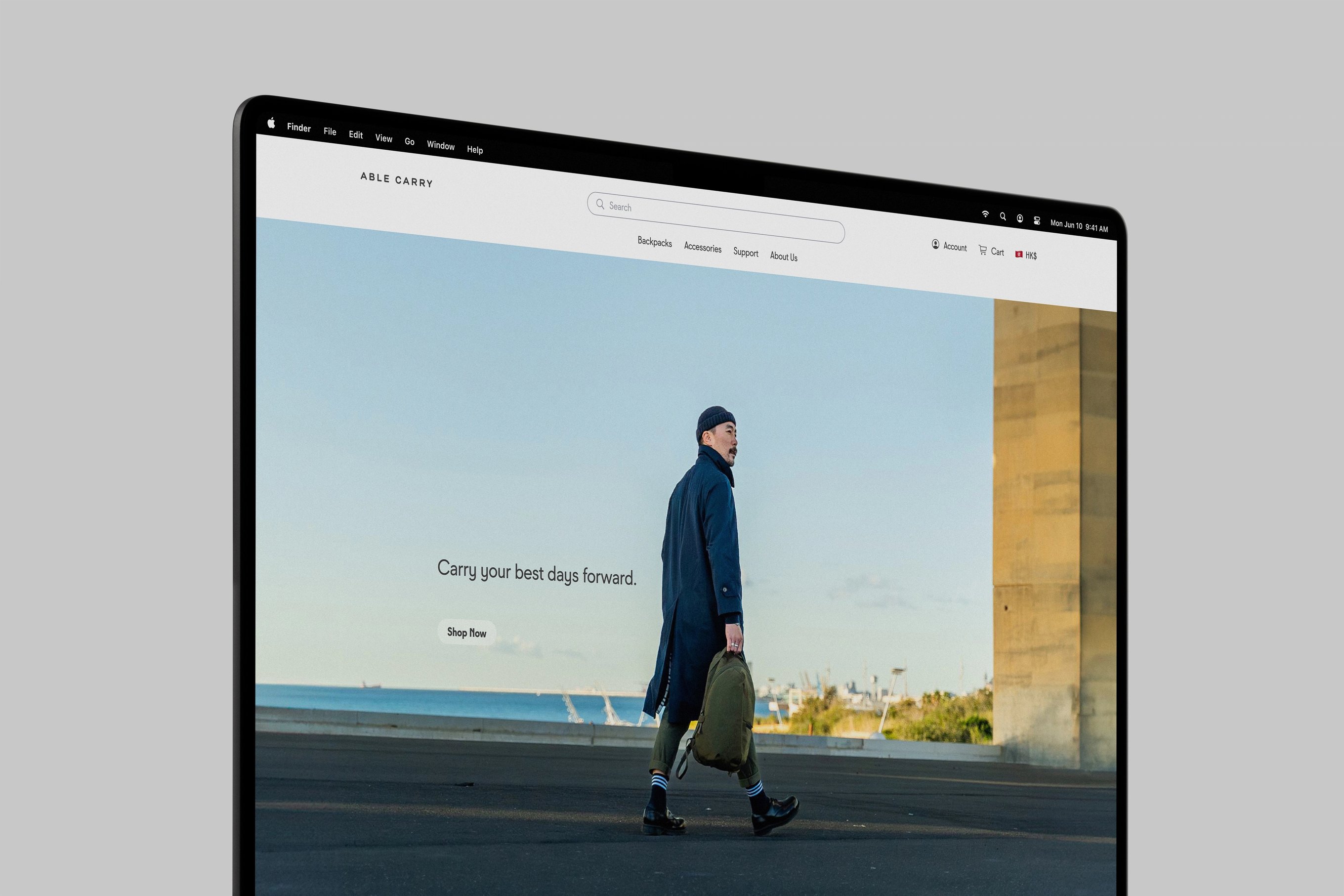 A MacBook Pro displaying the homepage of Able Carry's website on its monitor.