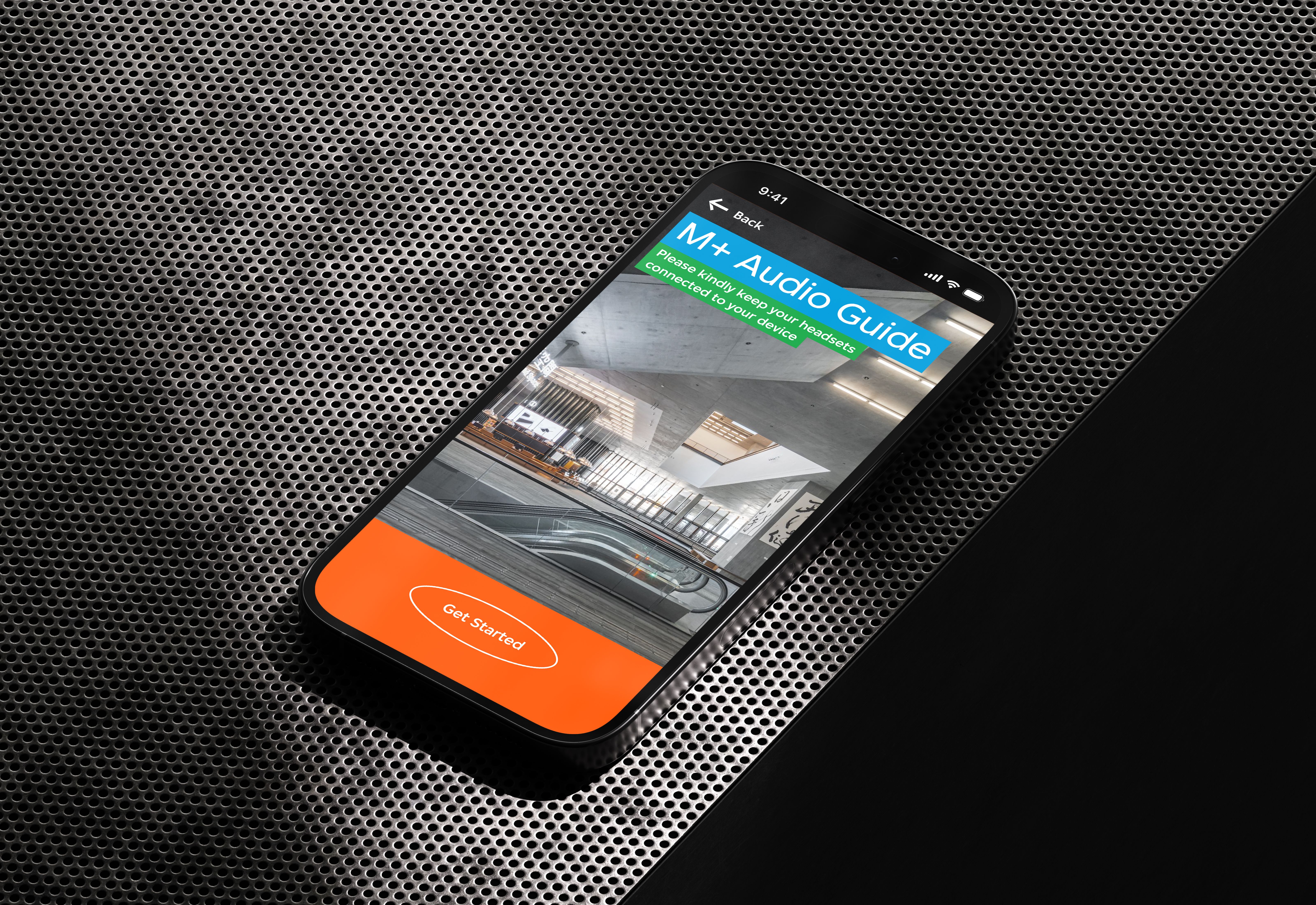 The M+ Audio Guide start up interface on an iPhone 14 Pro's display.