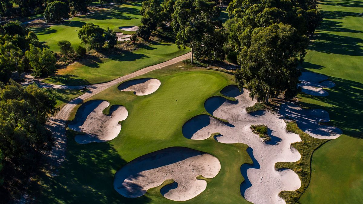 Aerial view of a green surrounded by sculpted bunkers at Huntingdale Golf Club, Melbourne