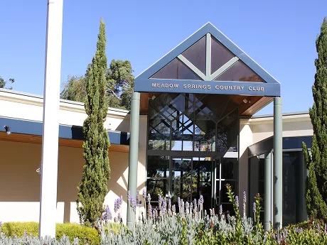 The entrance to the Meadow Springs Country Club clubhouse