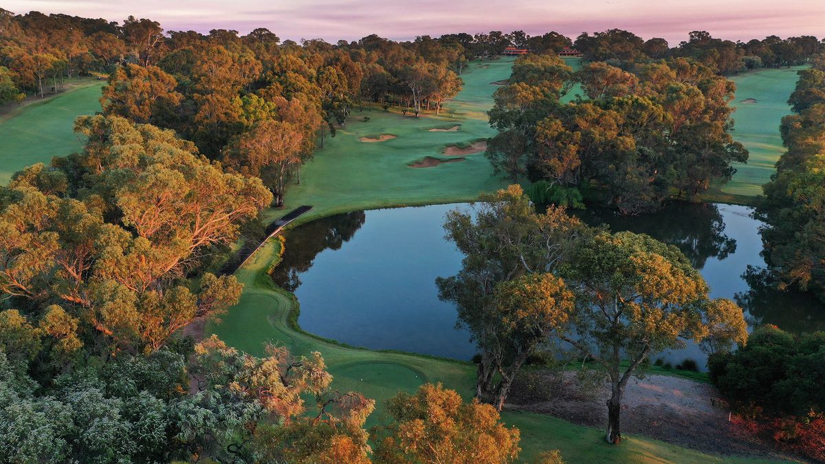 Aerial view of a fairway, lake and green at Lake Karrinyup Country Club, Perth, at sunset