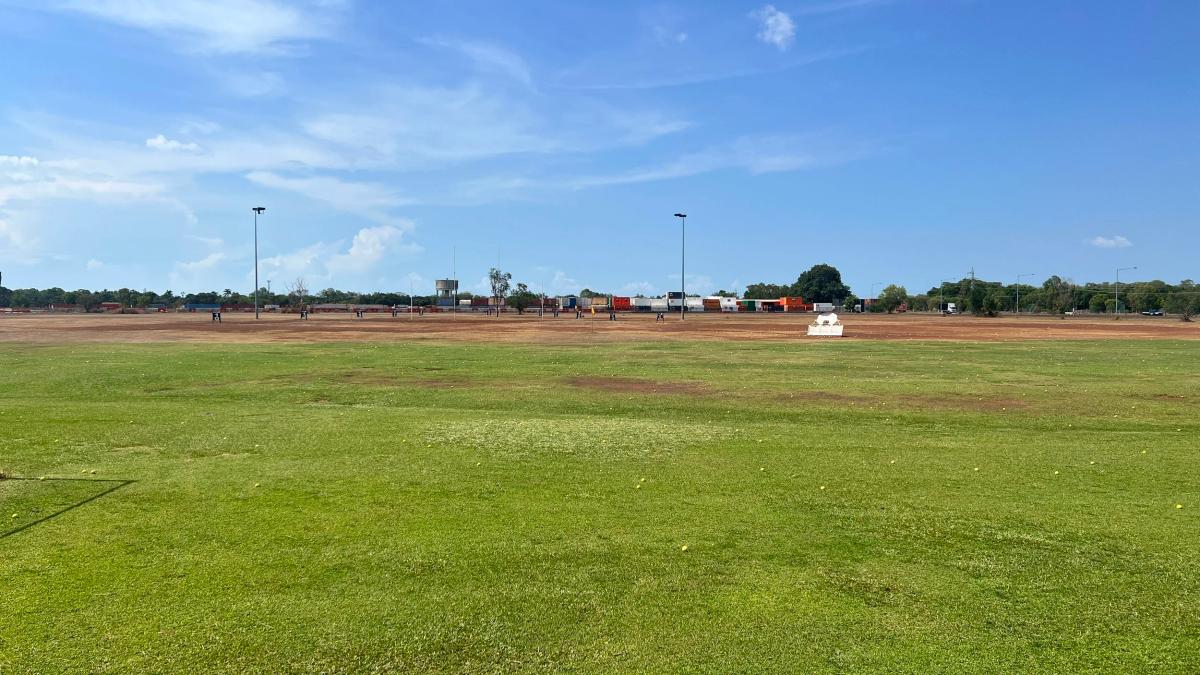 Outdoor driving range bays and grass tee area at Flight Path Golf & Outdoor Recreation