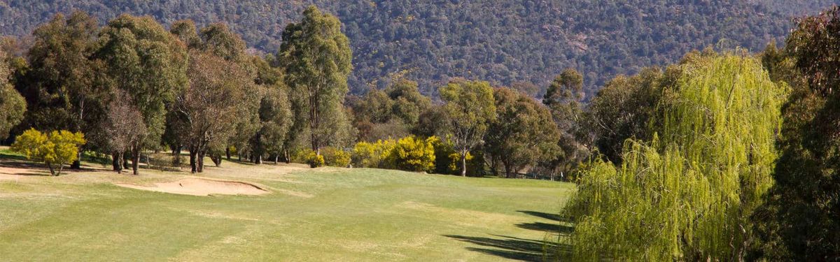 Fairway and bunker at Murrumbidgee Country Club with hills in the background