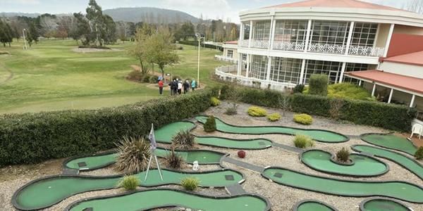 View of the clubhouse, fairway and mini-golf course at Canberra International Golf Centre.