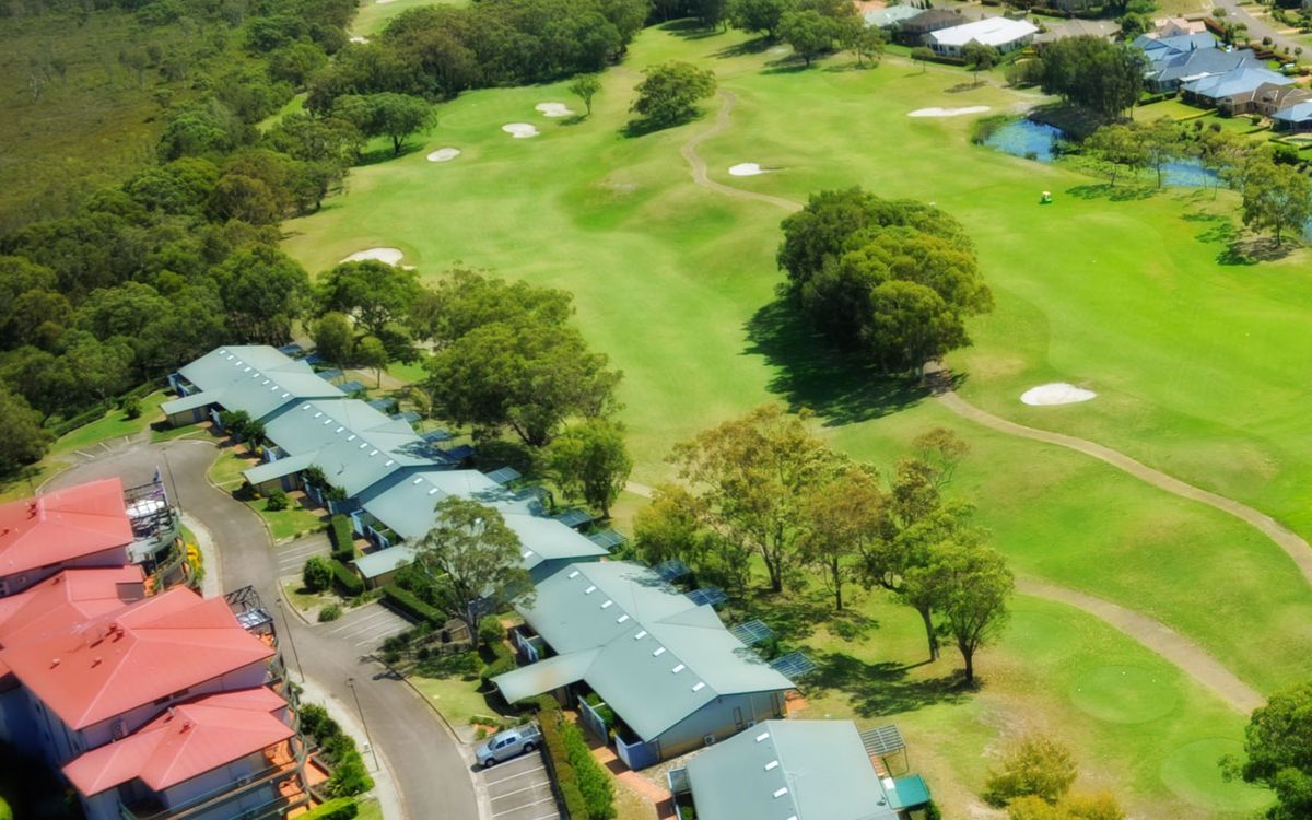 Aerial view of a fairway with bunkers and surrounding villas at Horizons Golf Resort
