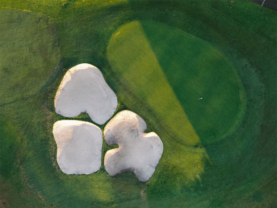 Top-down aerial view of a green and three bunkers at Latrobe Golf Club, Melbourne