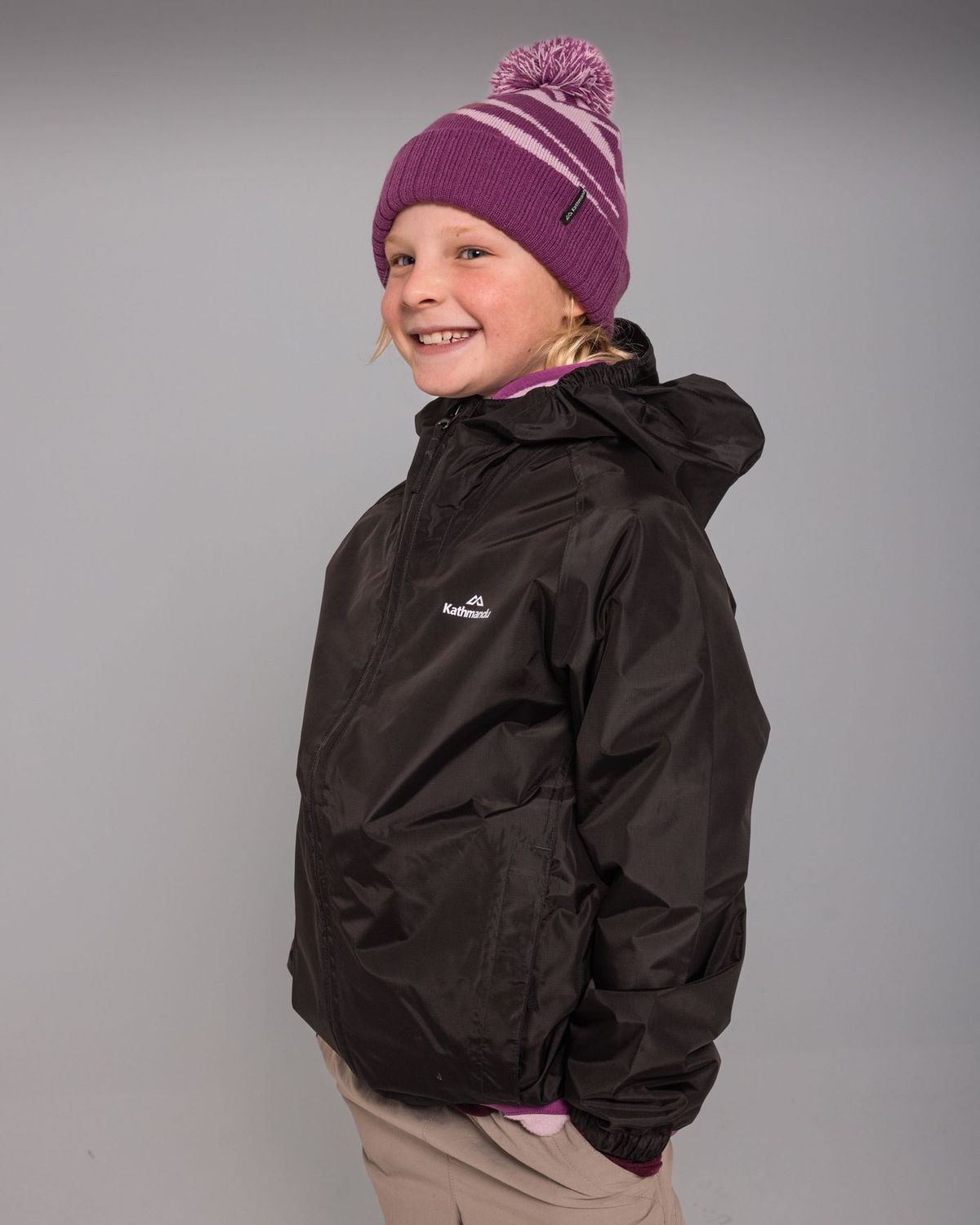 Kathmandu Kids' Pocket-it 2L Rain Jacket v4 - Black