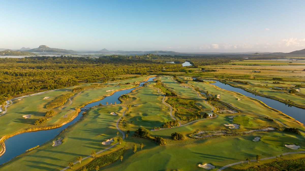 Aerial view of the river winding through fairways and bunkers at Maroochy River Golf Club