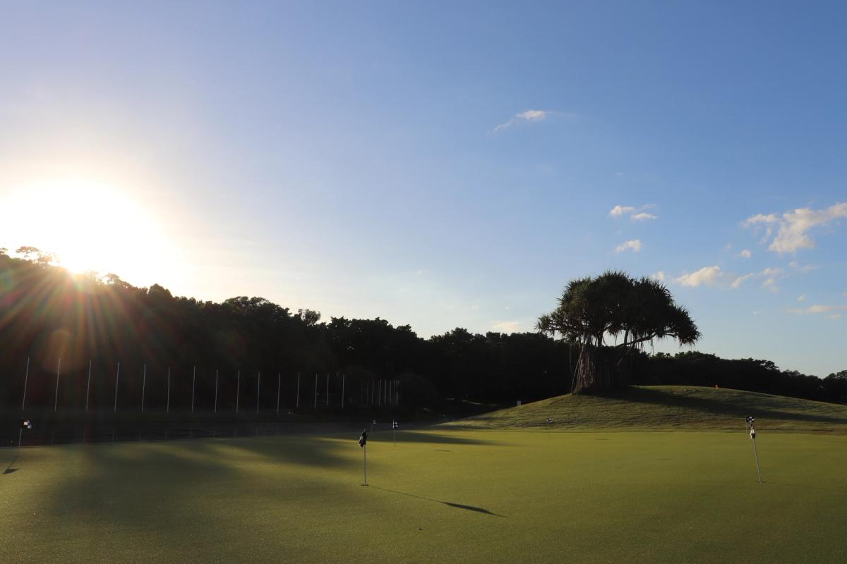 Sunset over the putting green and practice facility at Palmer Coolum Resort
