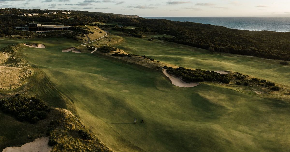 Aerial view of The National Golf Club's Gunnamatta course on the Mornington Peninsula, with the clubhouse and coastline in view