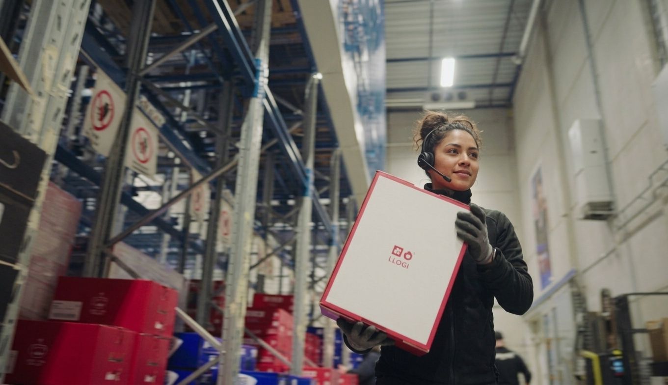 Woman picking goods in the warehouse