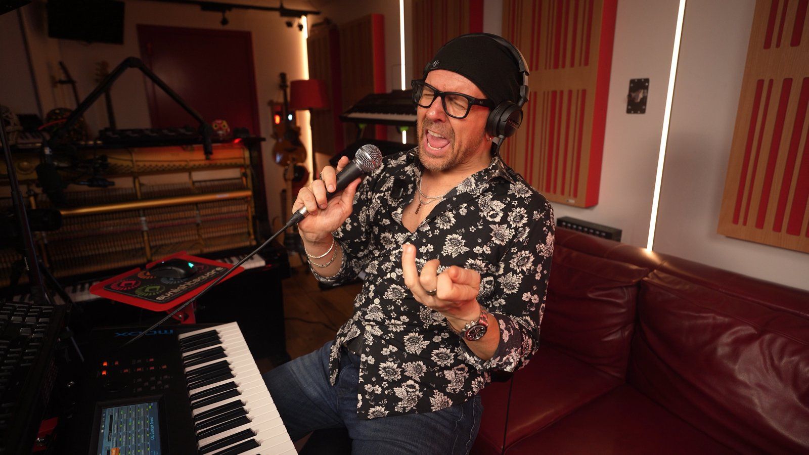 Claudio singing the guide vocal into a handheld mic