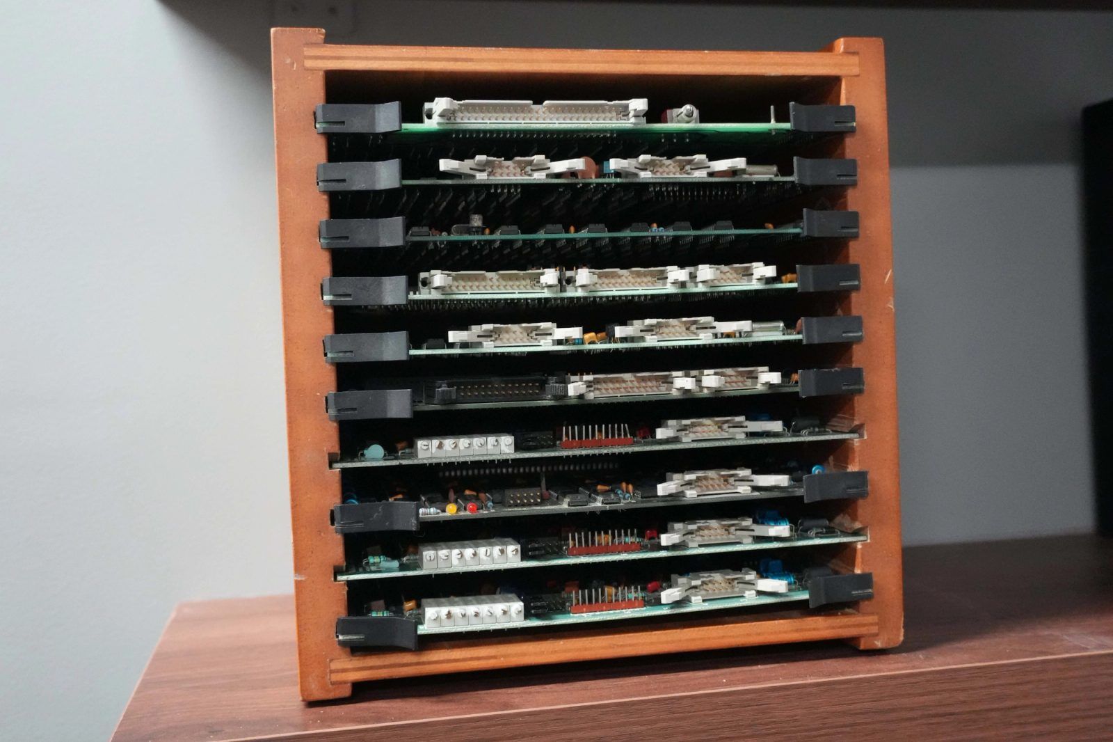 A wooden rack of spare Fairlight boards