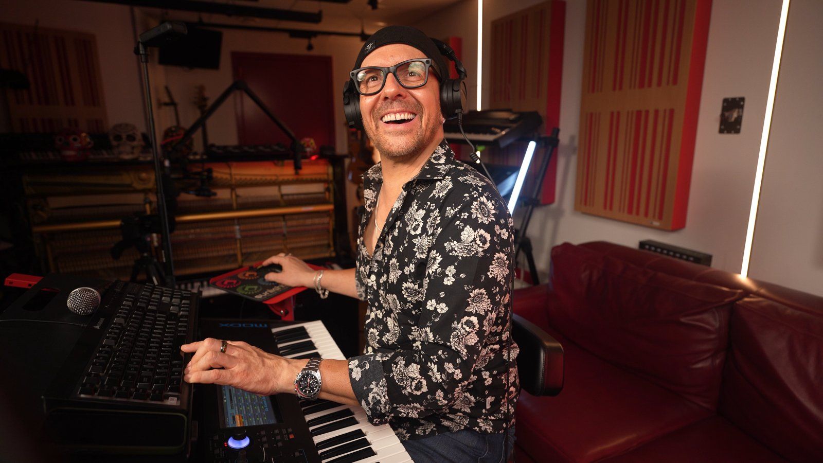 Claudio laughing at the keyboard after hearing the kids' choir