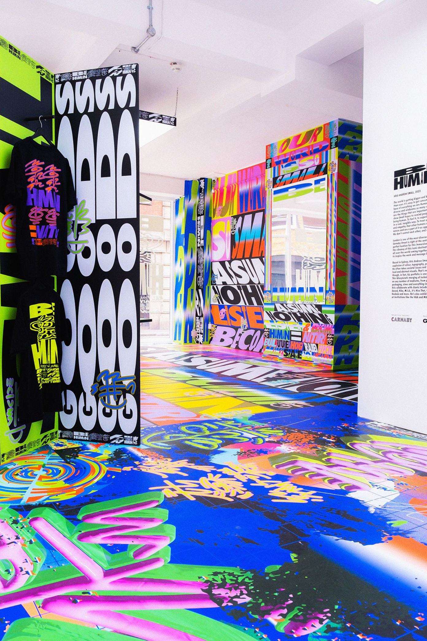 A room entirely covered with brightly coloured artwork by Kris Andrew Small
