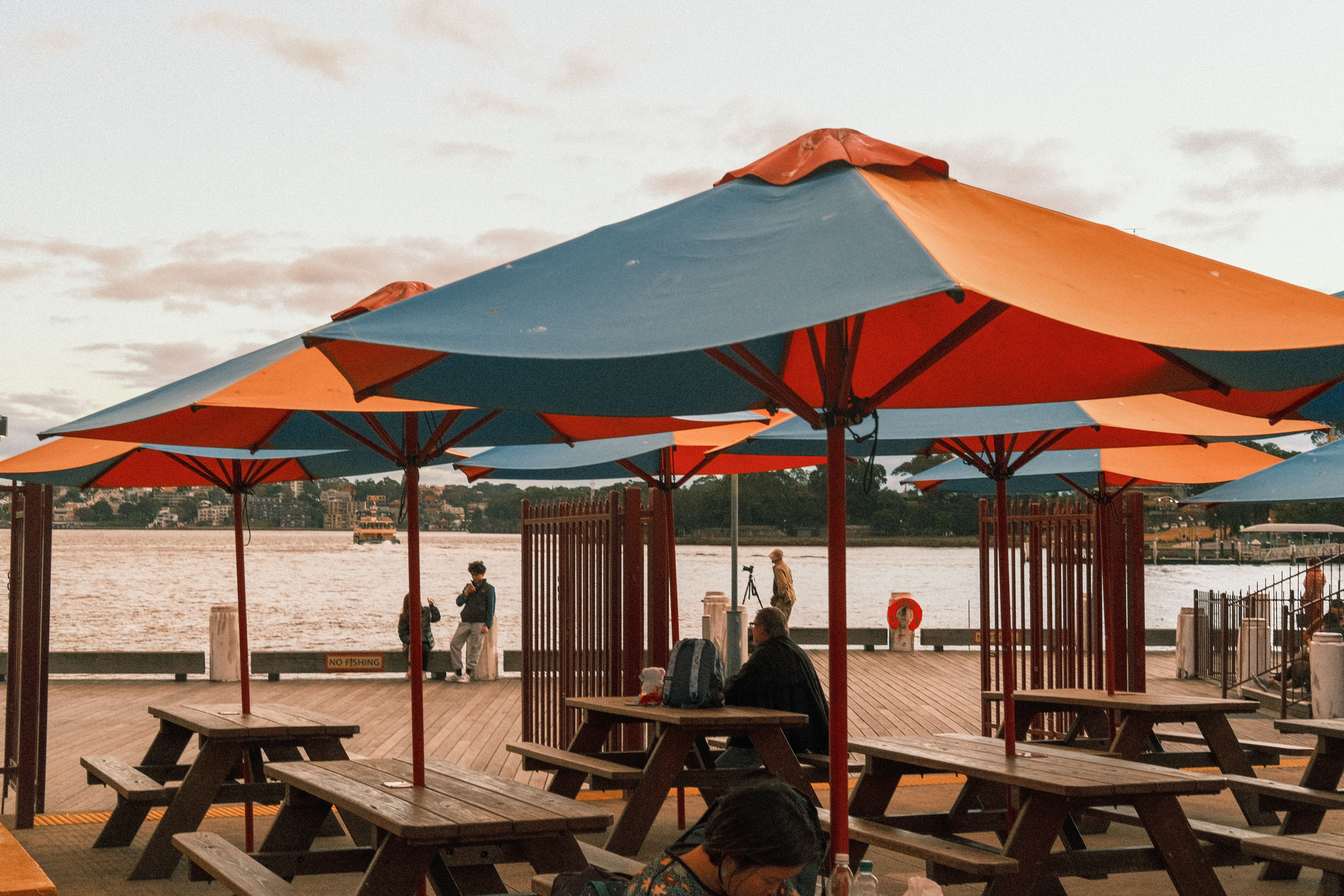 Umbrellas and outdoor seating at the waterfront