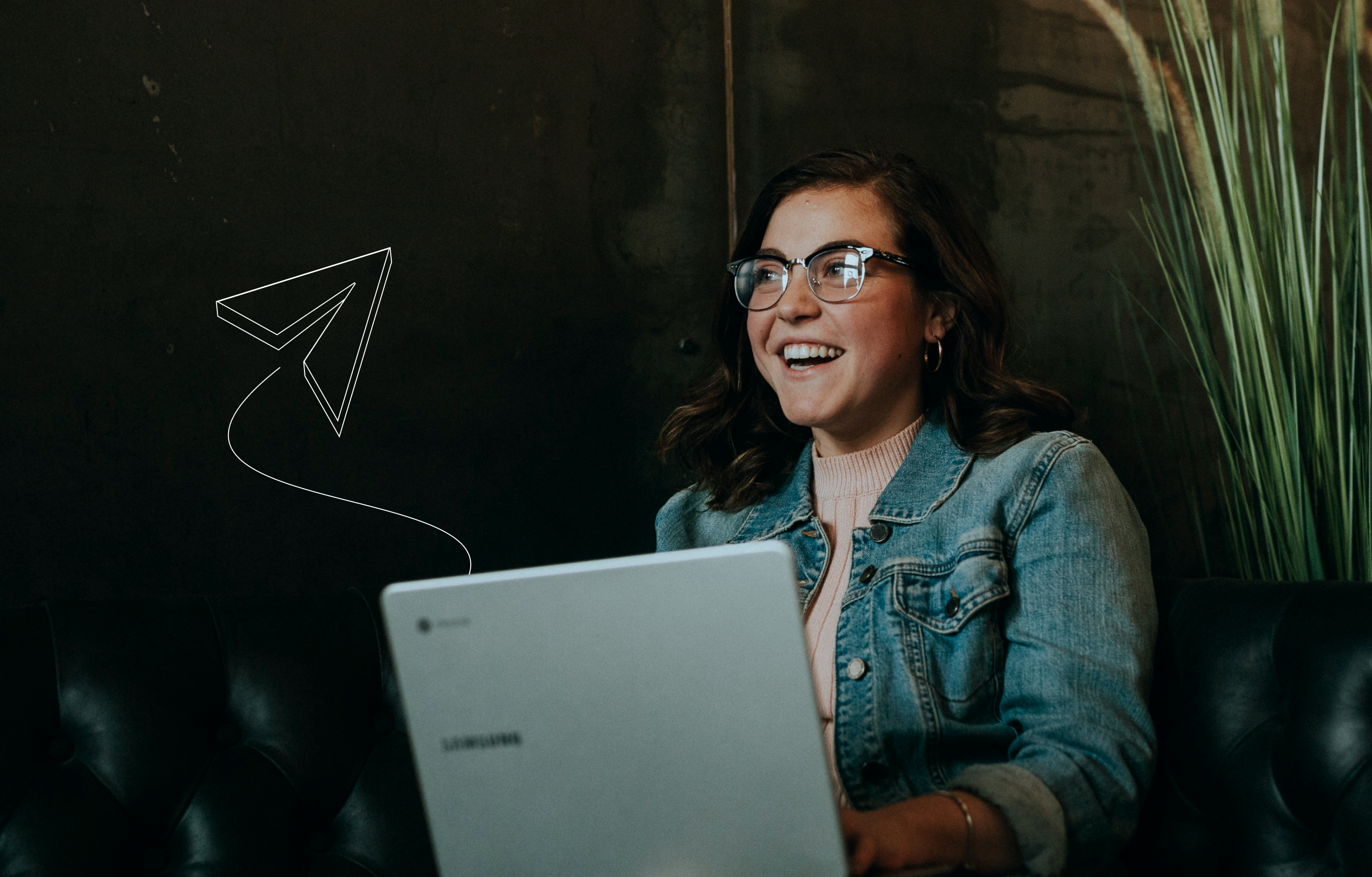 A young woman smiling while using her laptop, with a small illustration of a paper plane coming from the laptop overlaid